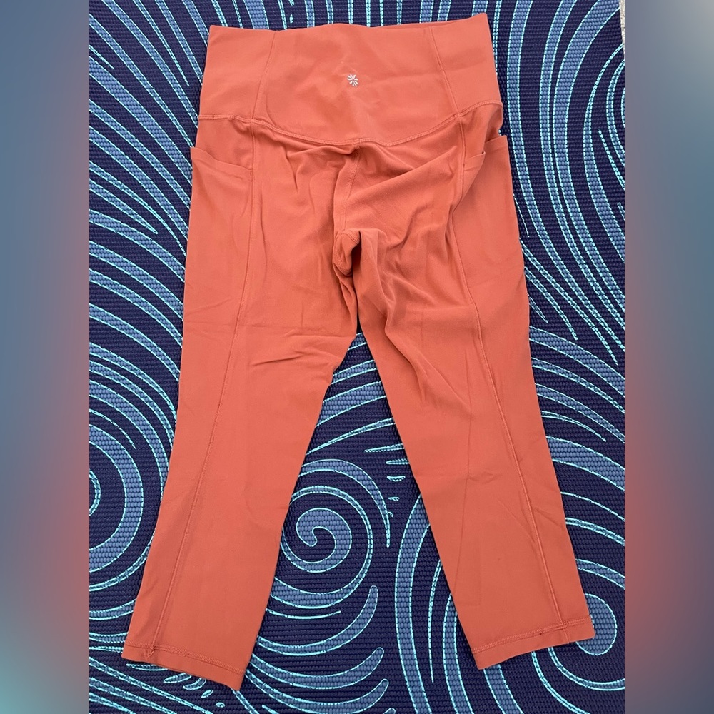 Athleta women's Salutation Stash Pocket Tight size S orange